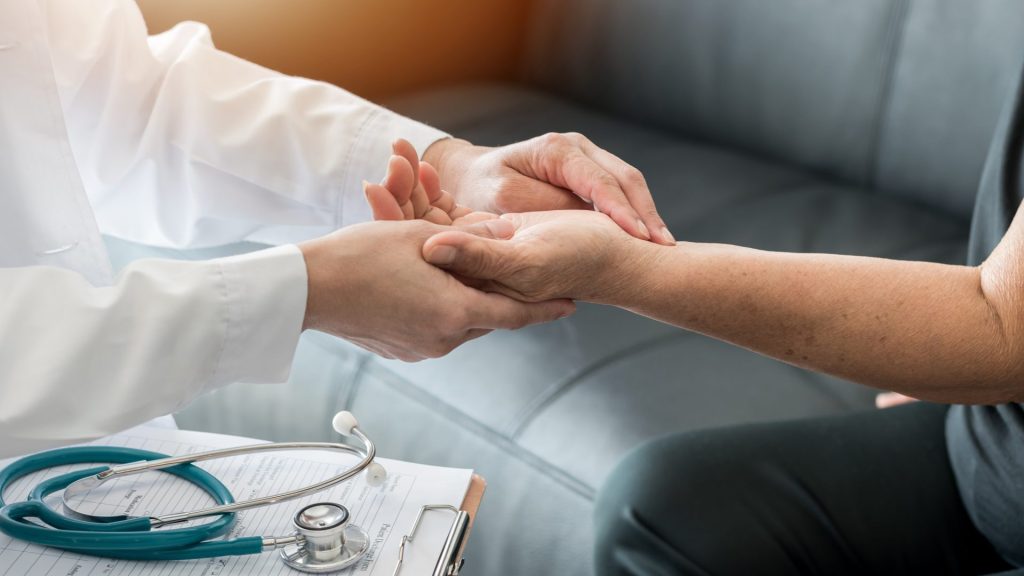 Doctor examining patient's wrist